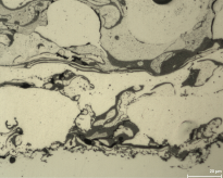 Metallografischer Querschliff einer thermischen Spritzschicht